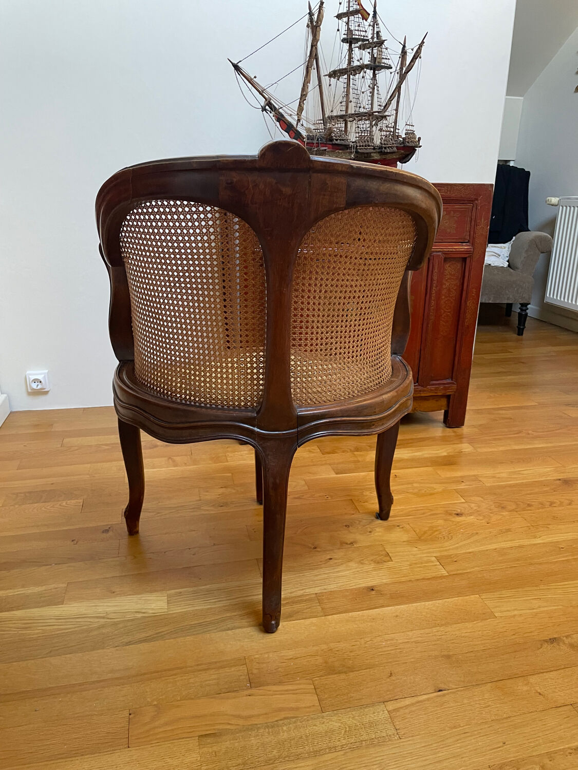 Cane seat armchair from the 19th century in the Louis XV style, known as "couillard".