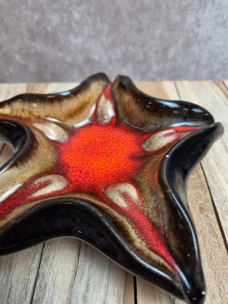 Vintage starfish bowl in ceramic Vallauris red and black lava style.