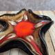Vintage starfish bowl in ceramic Vallauris red and black lava style.