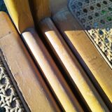 Four trendy tanned wooden chairs