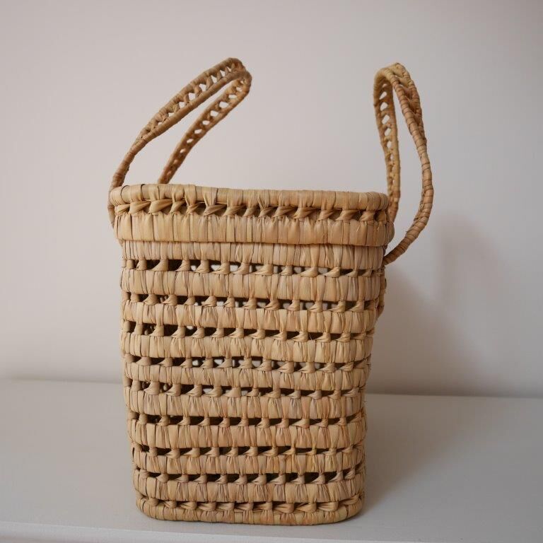 Basket made of woven palm leaves