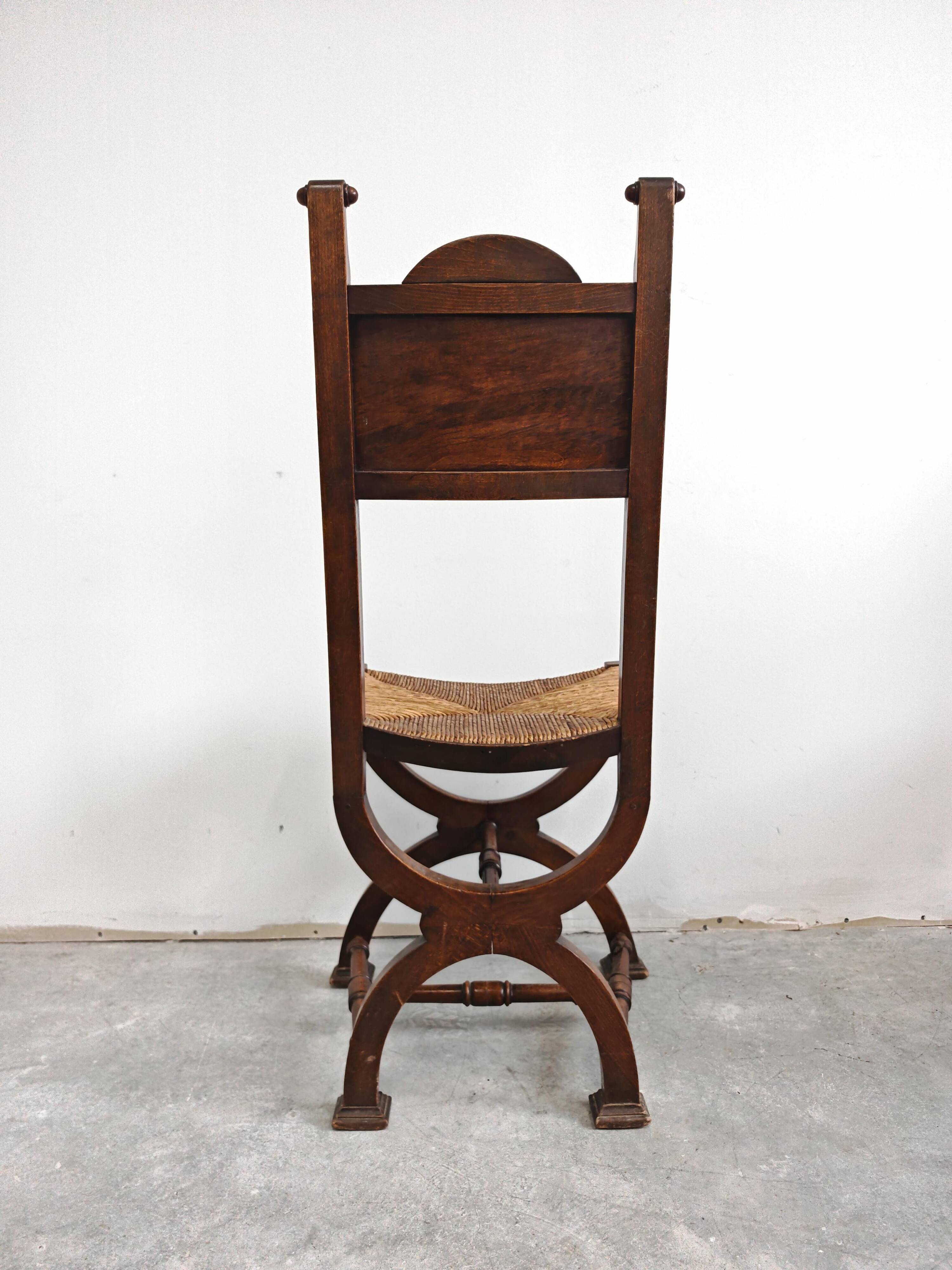Pair of Neo-Renaissance oak chairs with straw seats, 1910