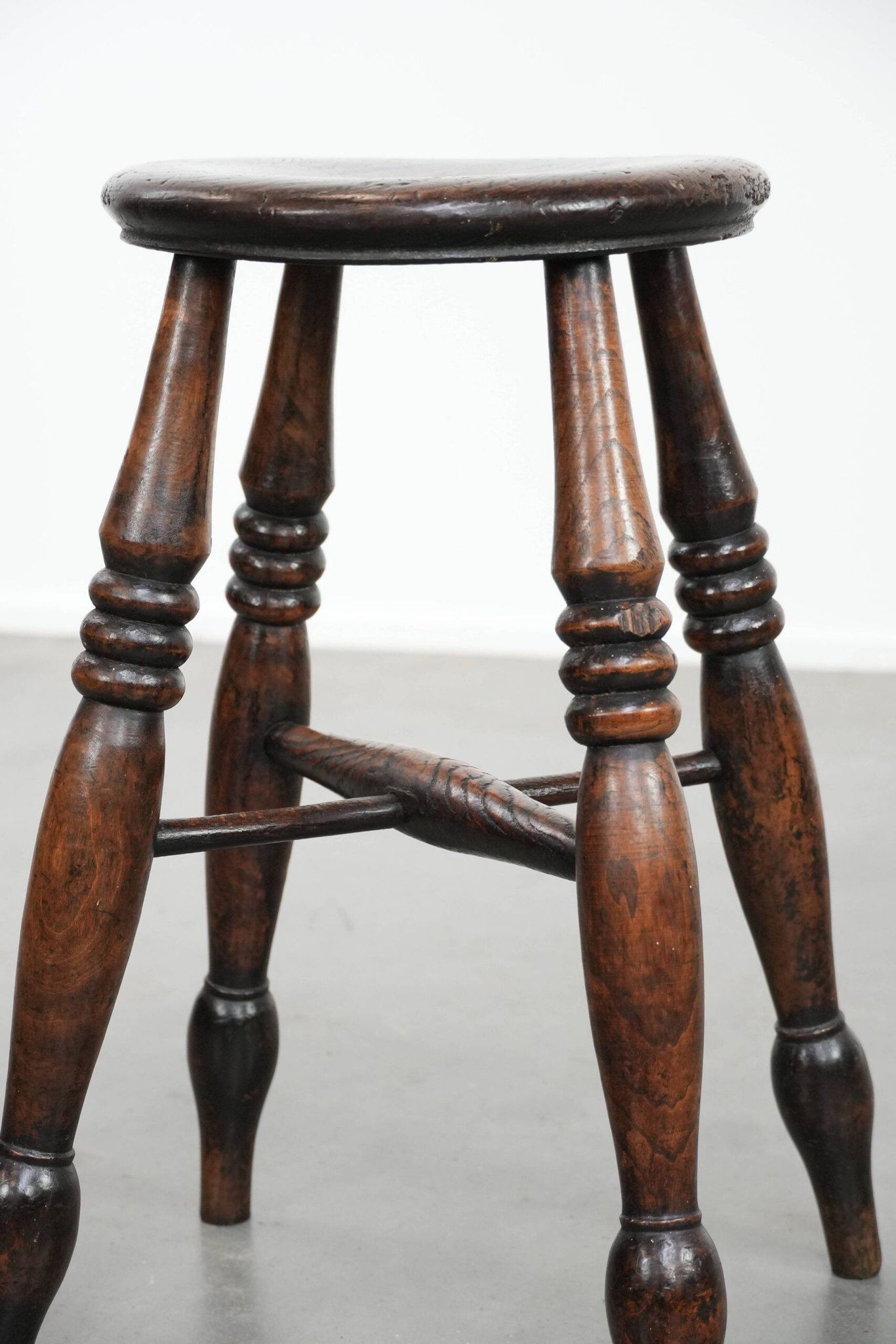 Antique English Windsor stool from the 18th century with a great patina