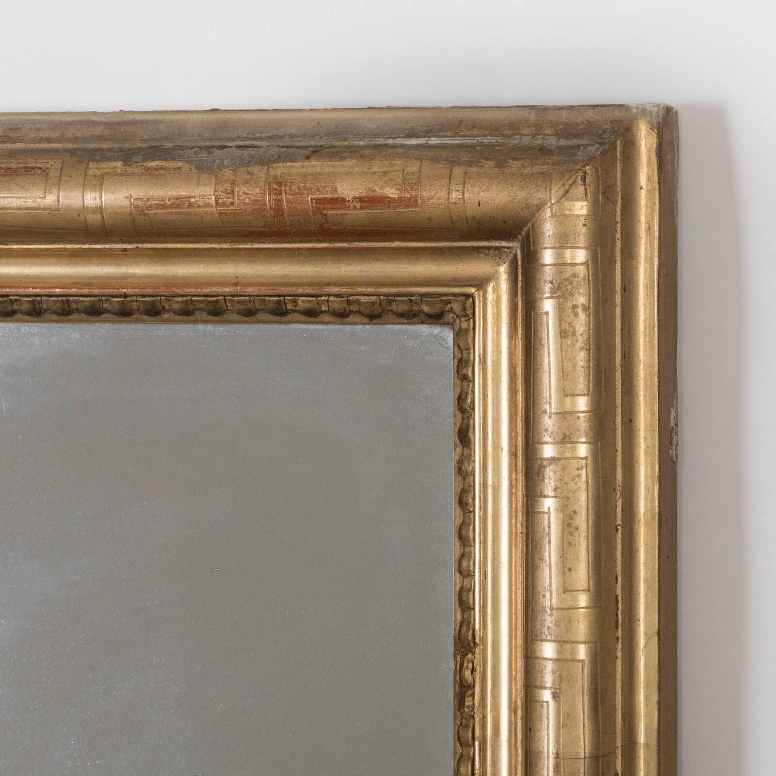 Nineteenth-century rectangular mirror with geometric pattern.