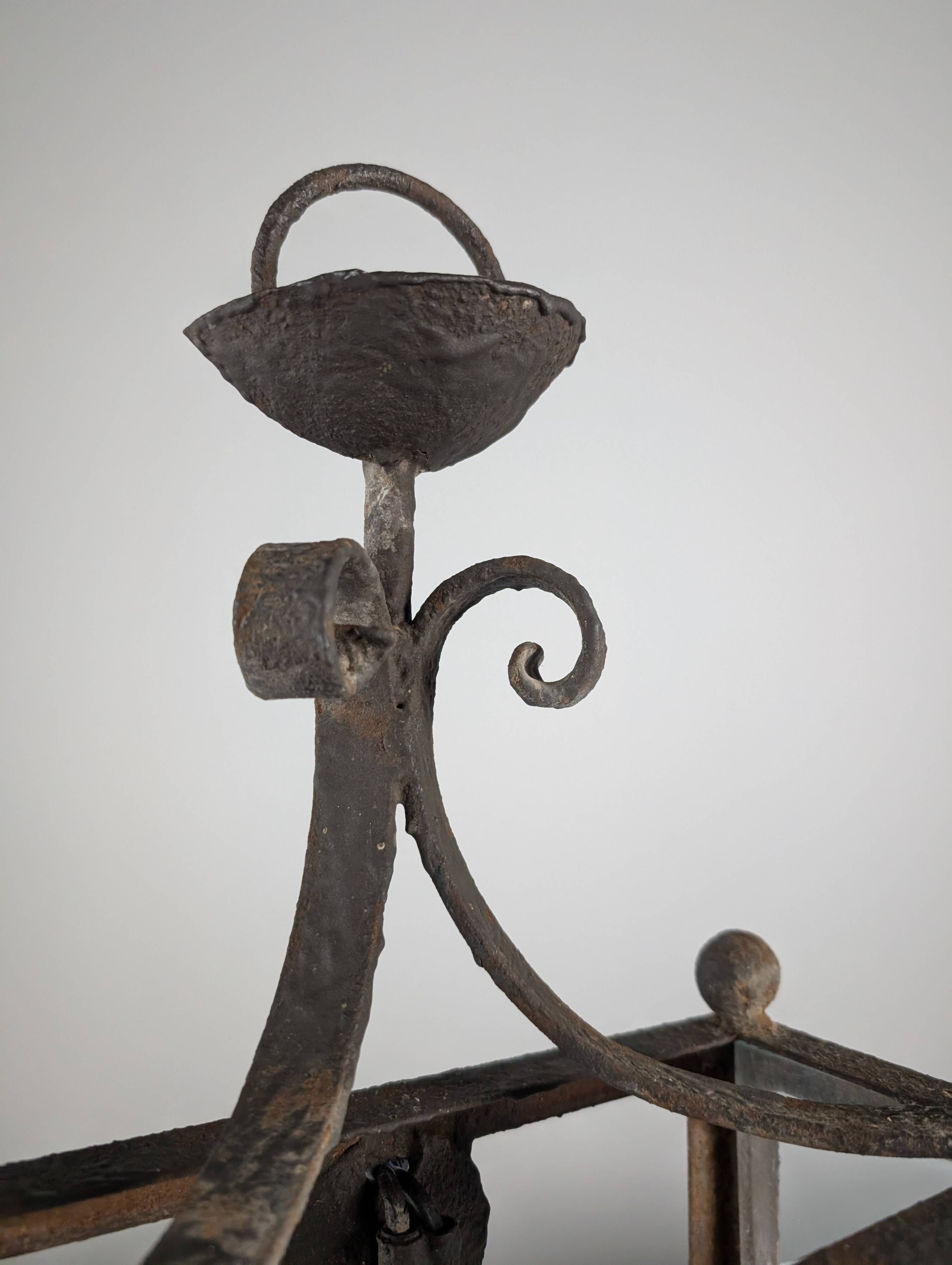 Wrought iron lantern with glass panels, leaf motifs