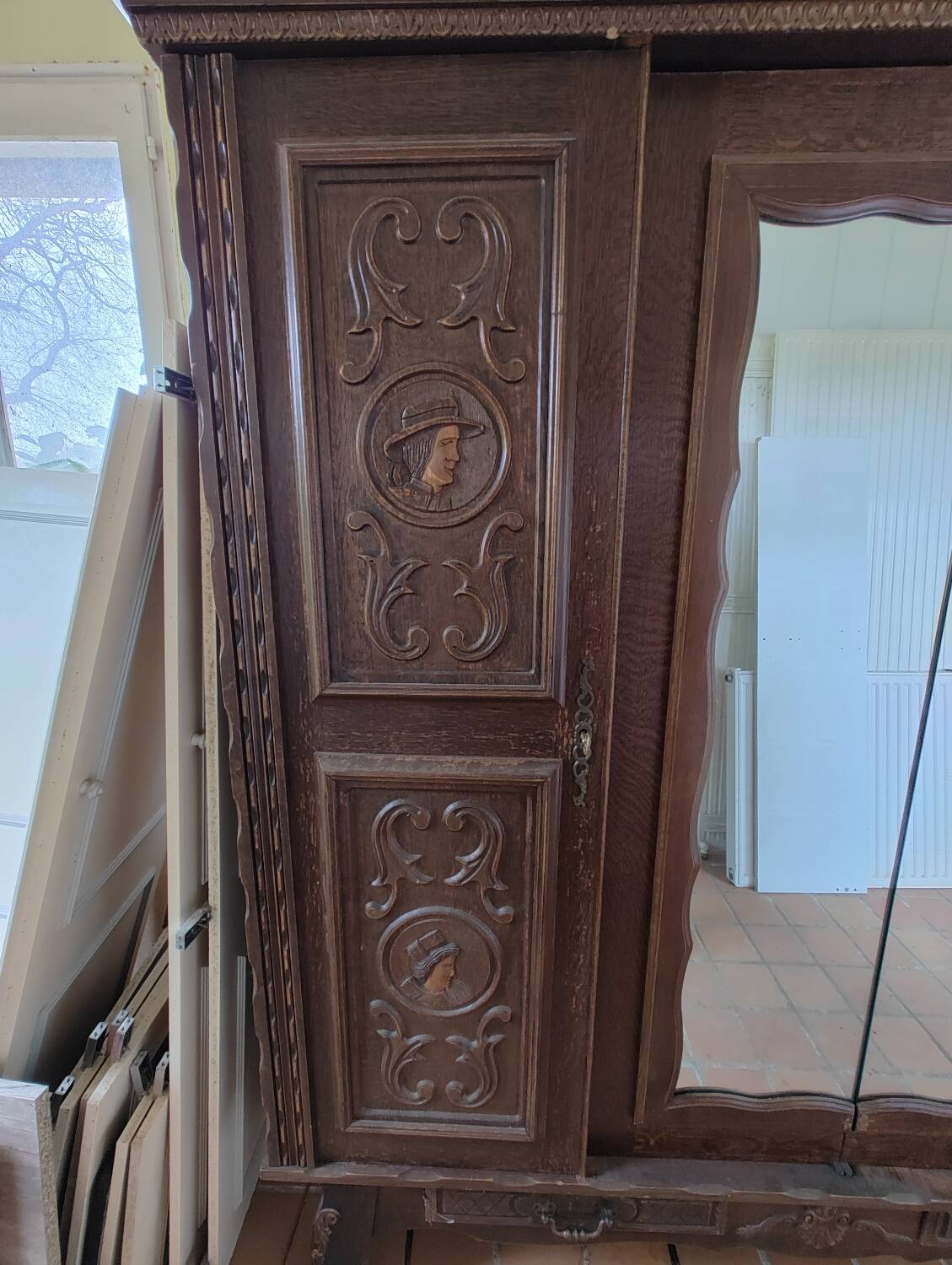 Antique wardrobe in Henri II style – carved oak – 4 doors with mirror