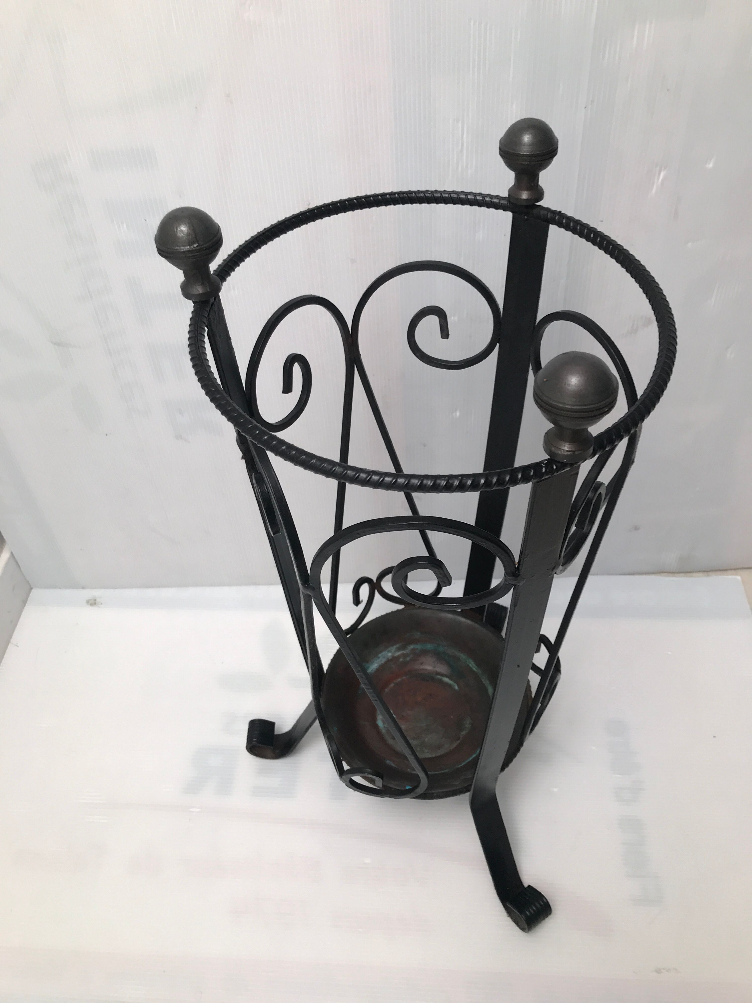 Wrought iron umbrella holder