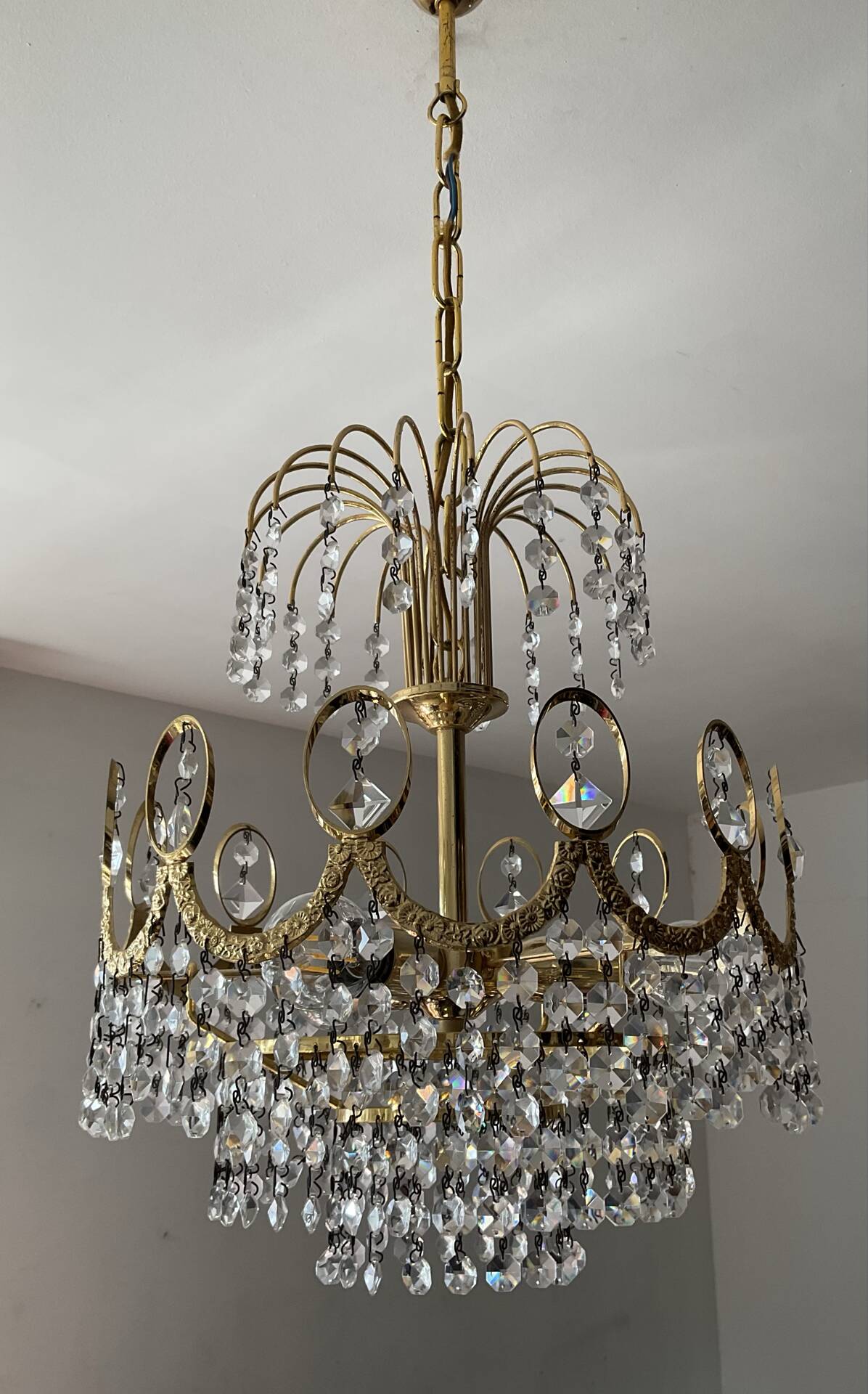 Brass chandelier with crystal pendants from the 1970s.