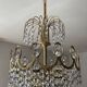 Brass chandelier with crystal pendants from the 1970s.