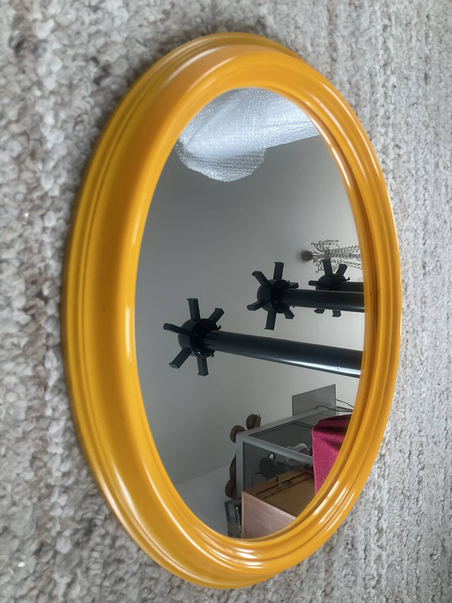 Vintage oval mirror from the 1970s.