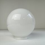 A pair of vintage opaline and brass wall lights