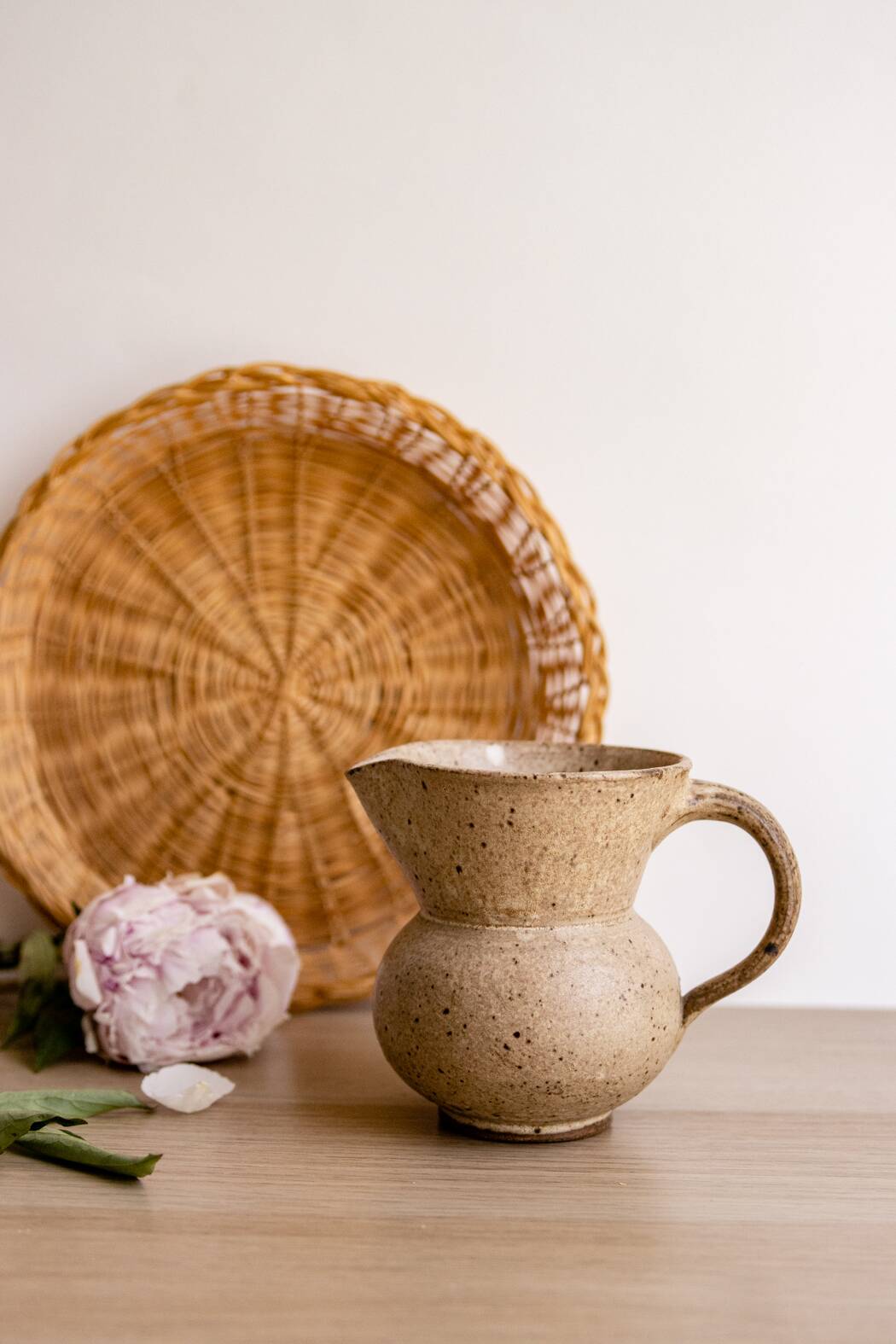 Small pitcher in old speckled stoneware