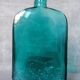 Blue engraved glass bottles