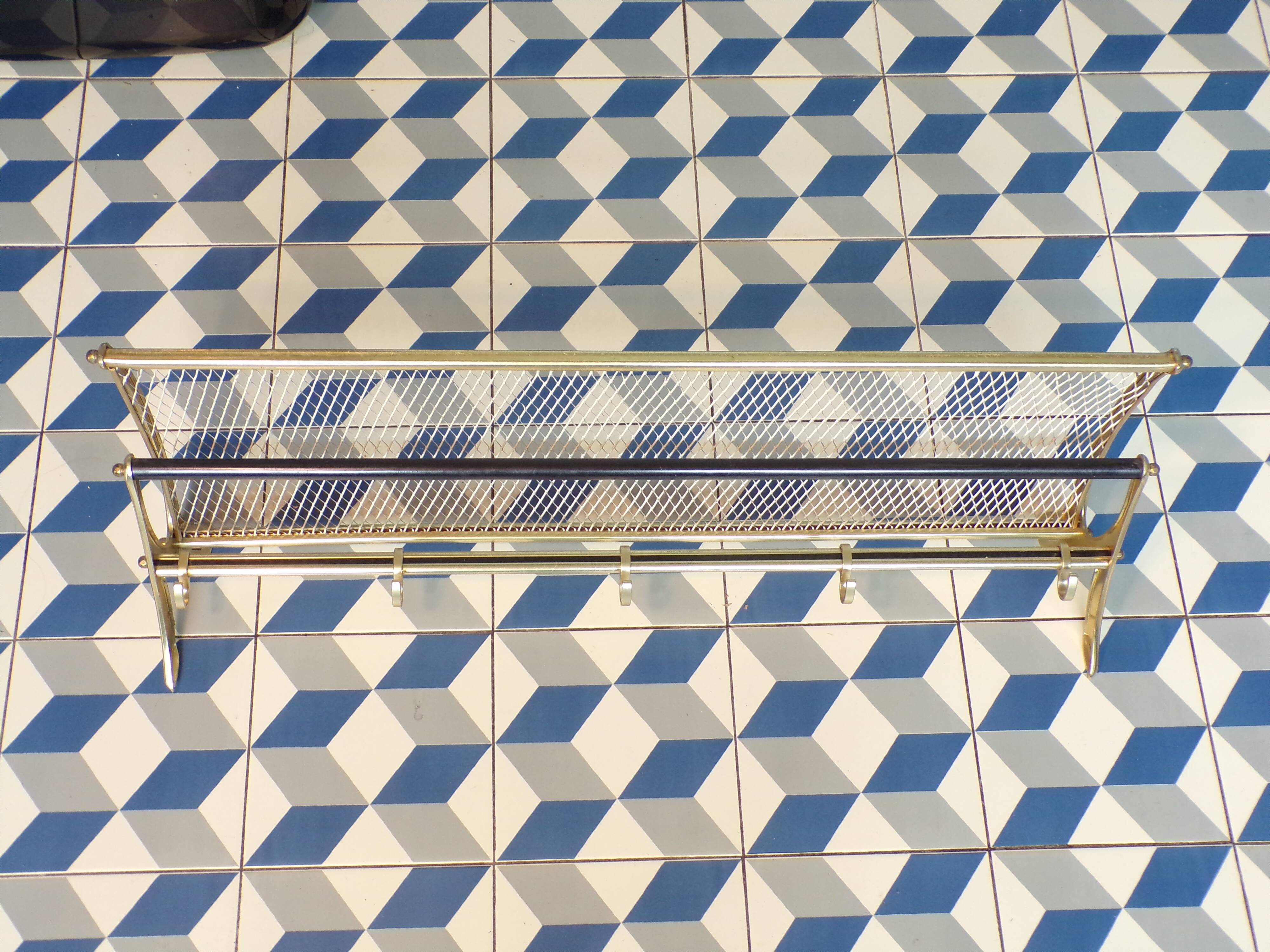 Vintage coat rack in the style of a train luggage rack.