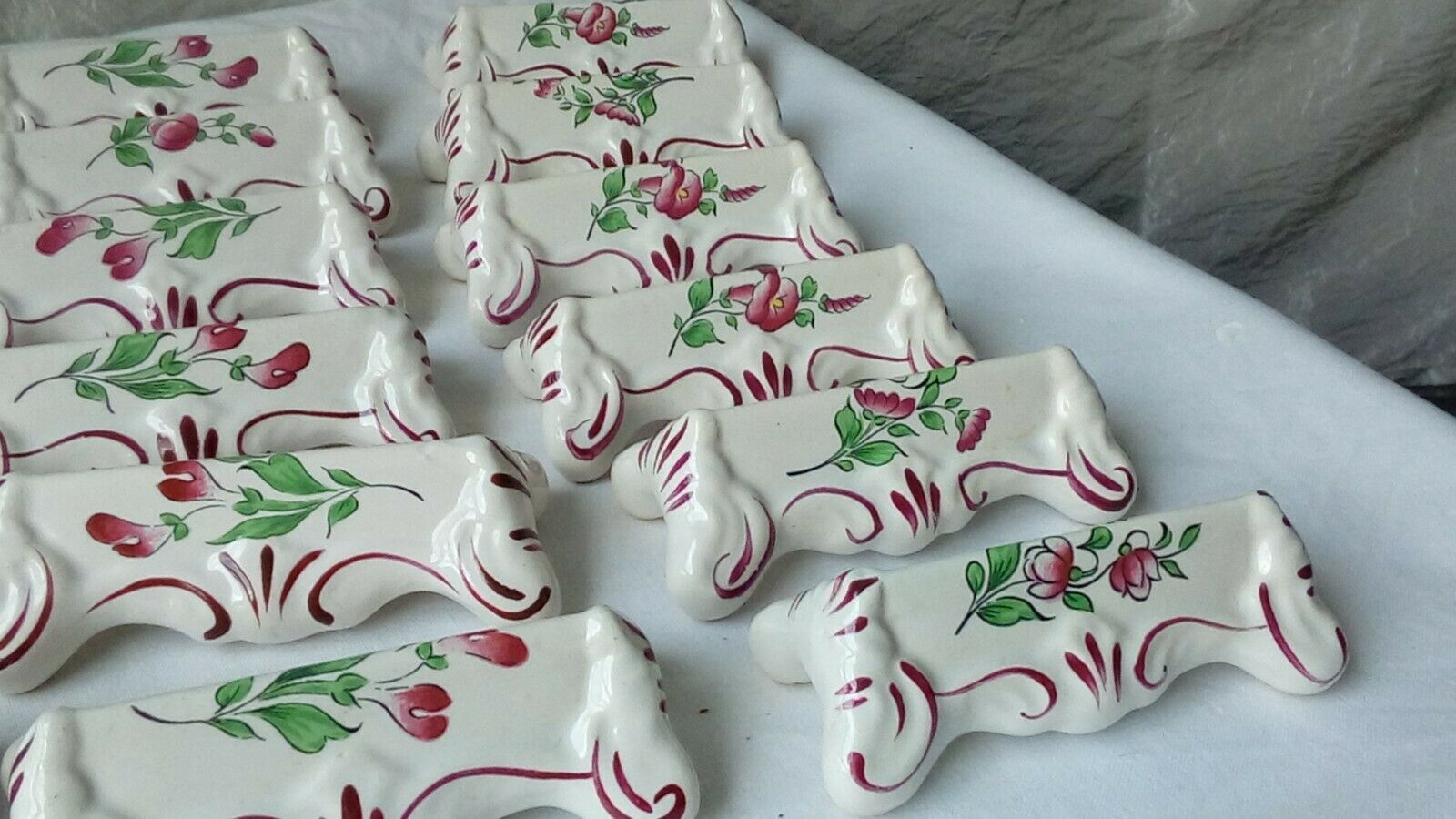 Suite of 18 knife holders in faience of luneville model reverbere