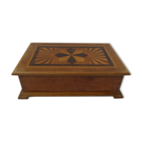 Branded wooden box decorated with suns