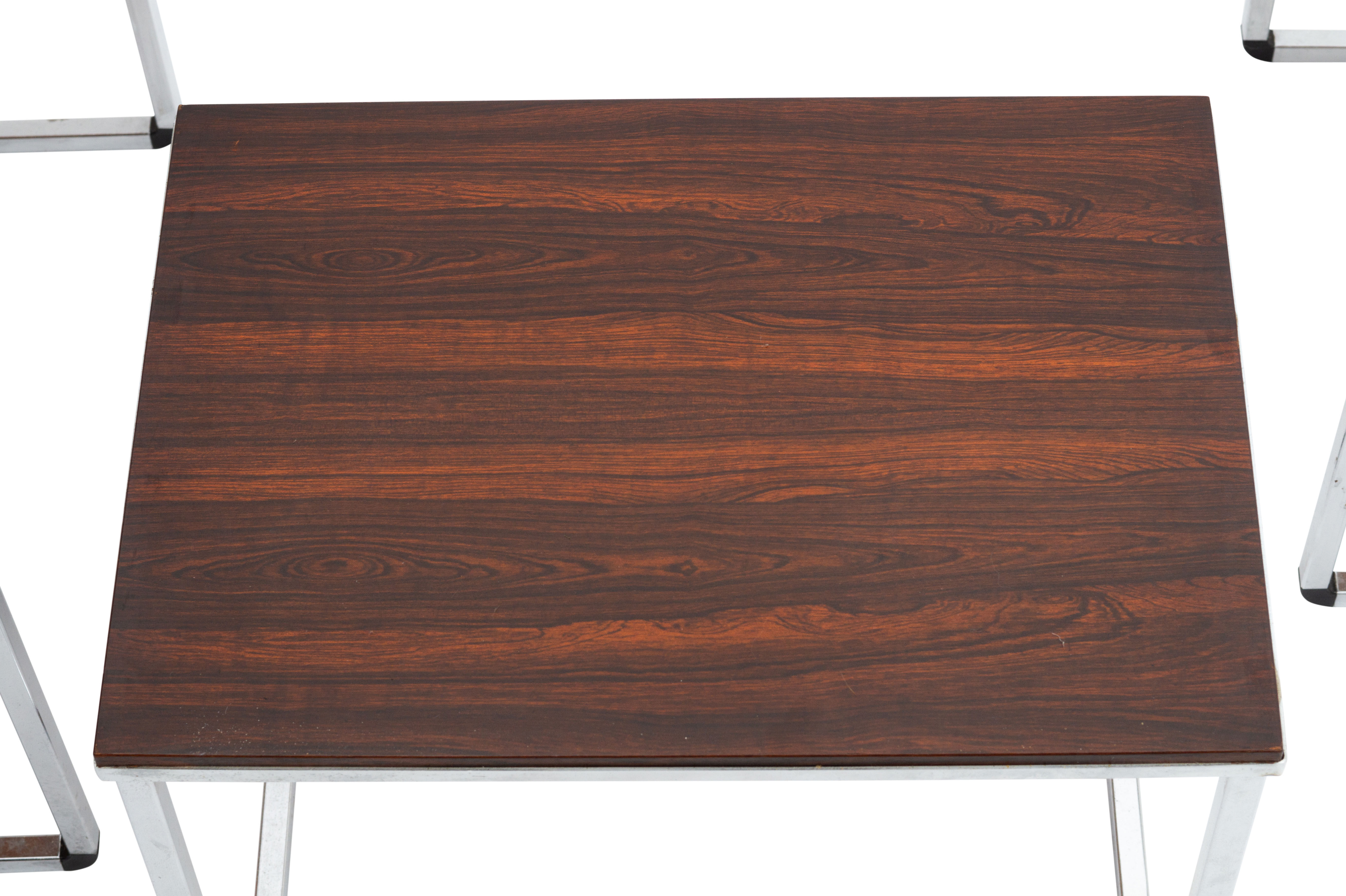 Vintage nesting table in rosewood and high polished metal base.