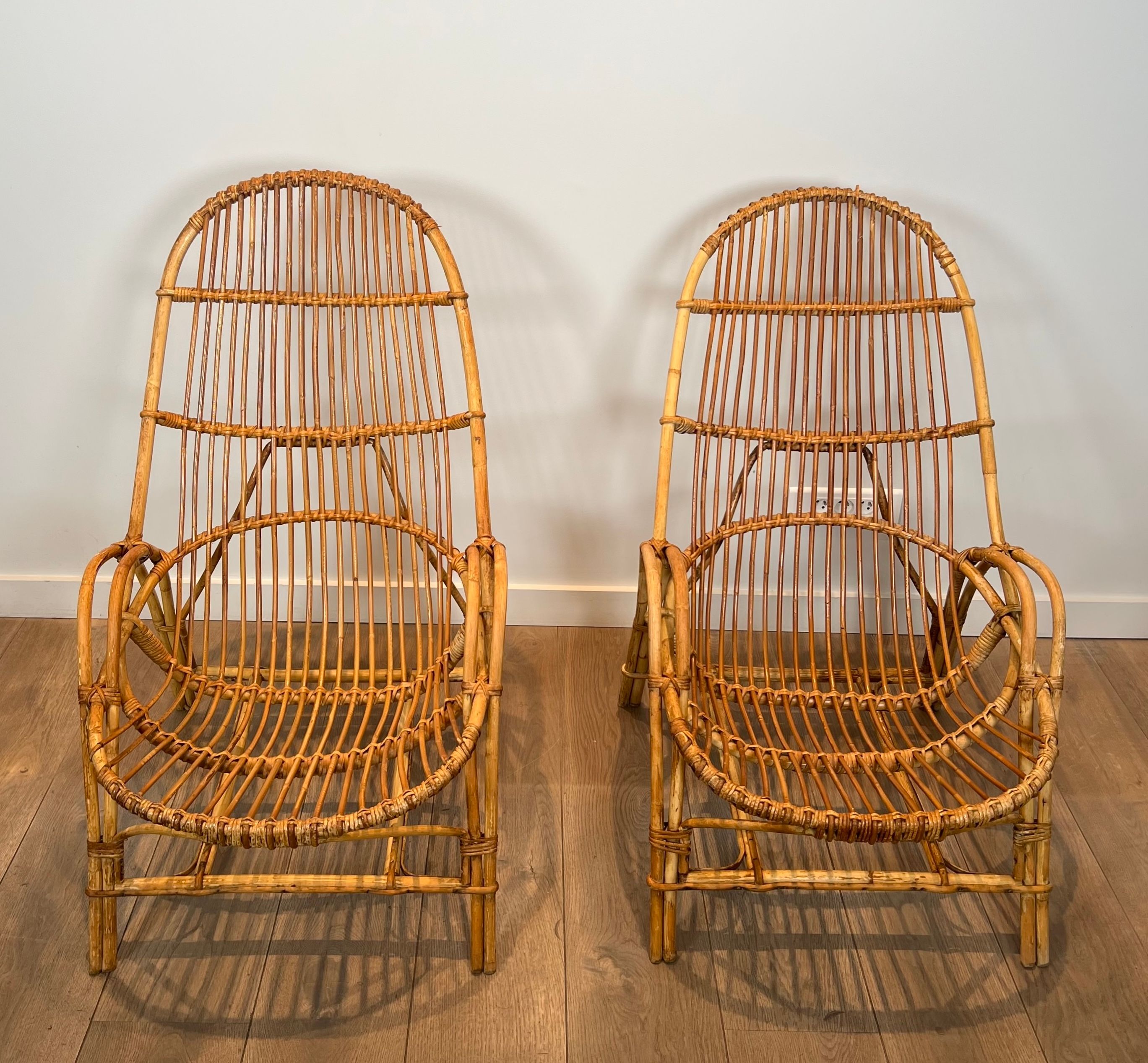 Pair of designer armchairs in rattan