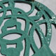 Enamelled cast iron trivet in blue with wrought iron decoration.