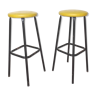 Pair of black metal bar stools and yellow imitation leather seat