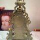 Fireplace trim clock and adornment of antique bronze candelabra