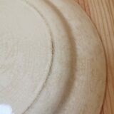 Large old round plate in iron earth