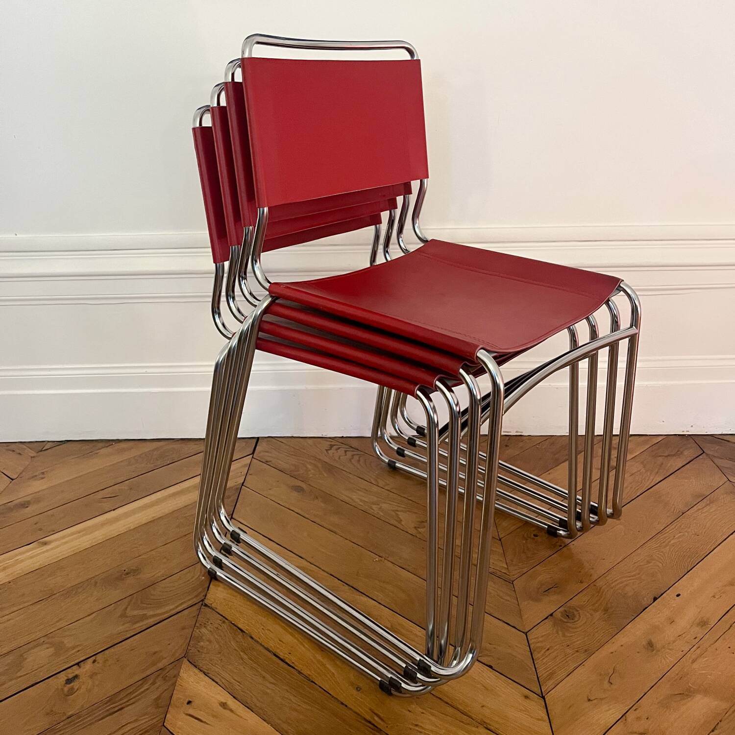 Set of 4 chairs in red leather and chrome tubular metal