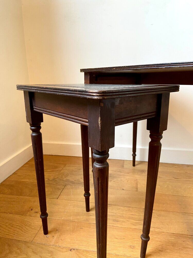 Dark wood and black leather tables