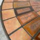 Capron “herbarium” coffee table with metal base