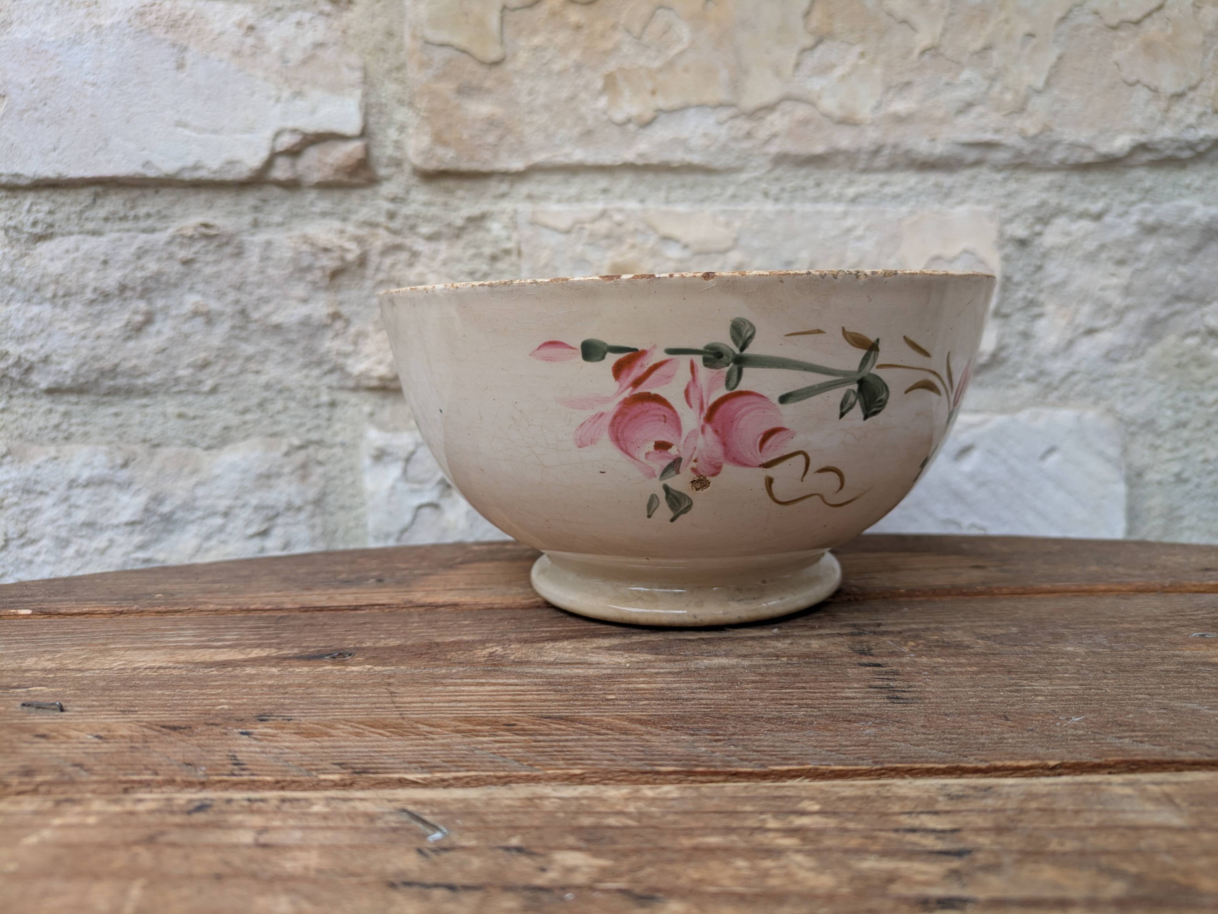 Old opaque porcelain bowl from Gien with a floral decoration.