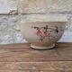 Old opaque porcelain bowl from Gien with a floral decoration.