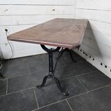 Table de bistrot pieds en fonte dessus en bois massif