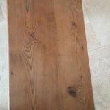 Church bench in fir tree with armrests
