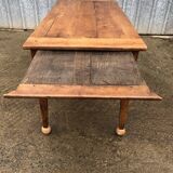 Antique solid cherry farmhouse table with 2 end drawers and 1 pull-out.