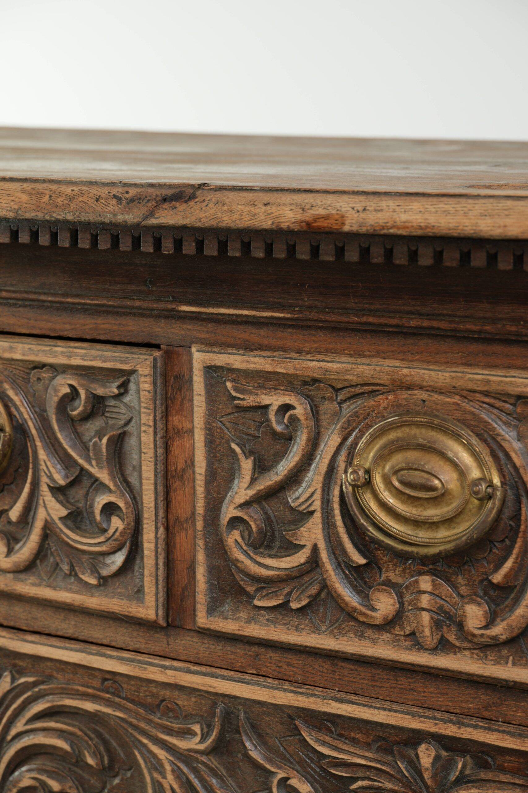 Richly carved English oak chest of drawers from the 18th century