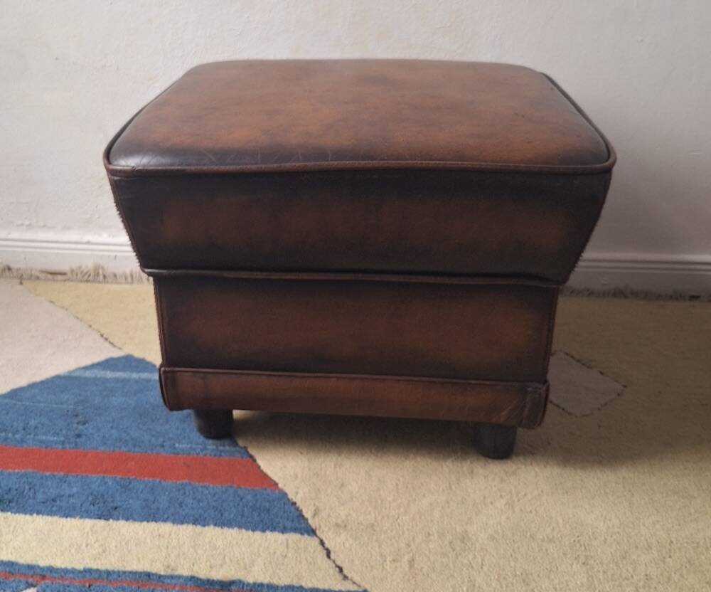 Vintage ottoman / pouffe in chestnut brown leather