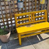 Old yellow teak school bench