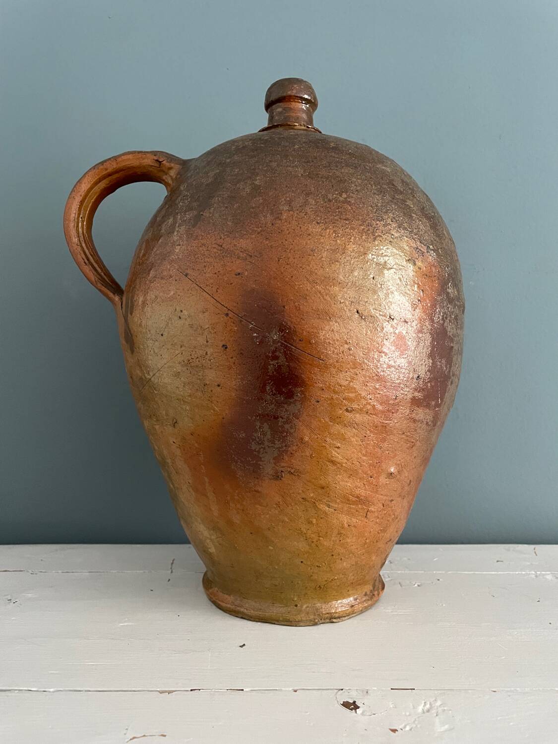 Large 19th century oil bottle in glazed earthenware