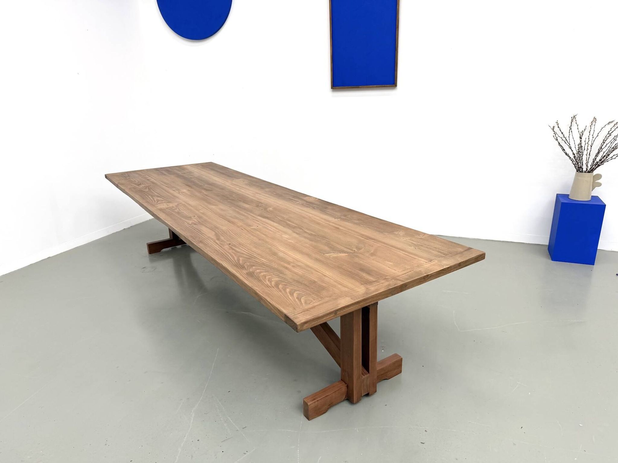 Refectory table in solid pine and beech, with X-shaped legs.