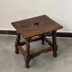Small antique wooden stool with an openwork pattern.