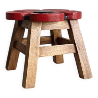 Small antique wooden stool with floral painted decoration.