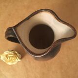 Antique ceramic pitcher with drips and striated patterns gradients of chestnuts