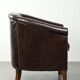 Dark cow leather club armchair in good condition with an English design