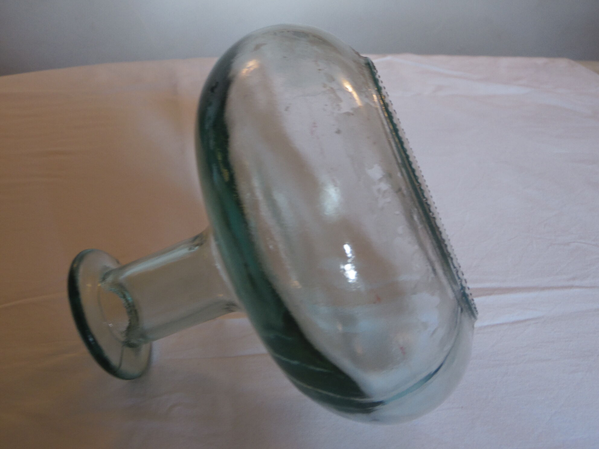 Pale green transparent glass flattened sphere shape vase