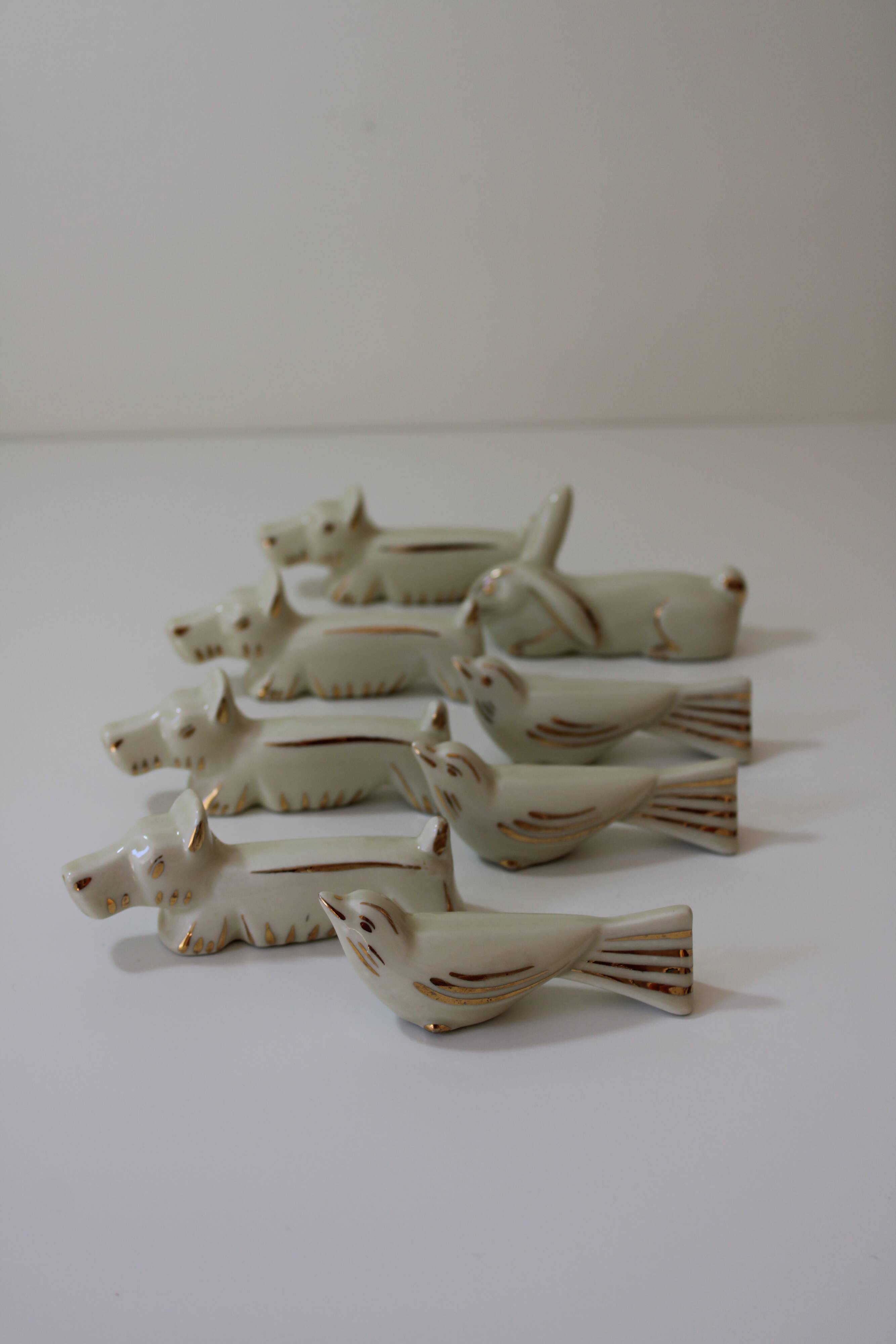 8 portes couteaux animaux porcelaine de Limoges vintage
