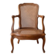 Low Louis XV armchair in wood and cane