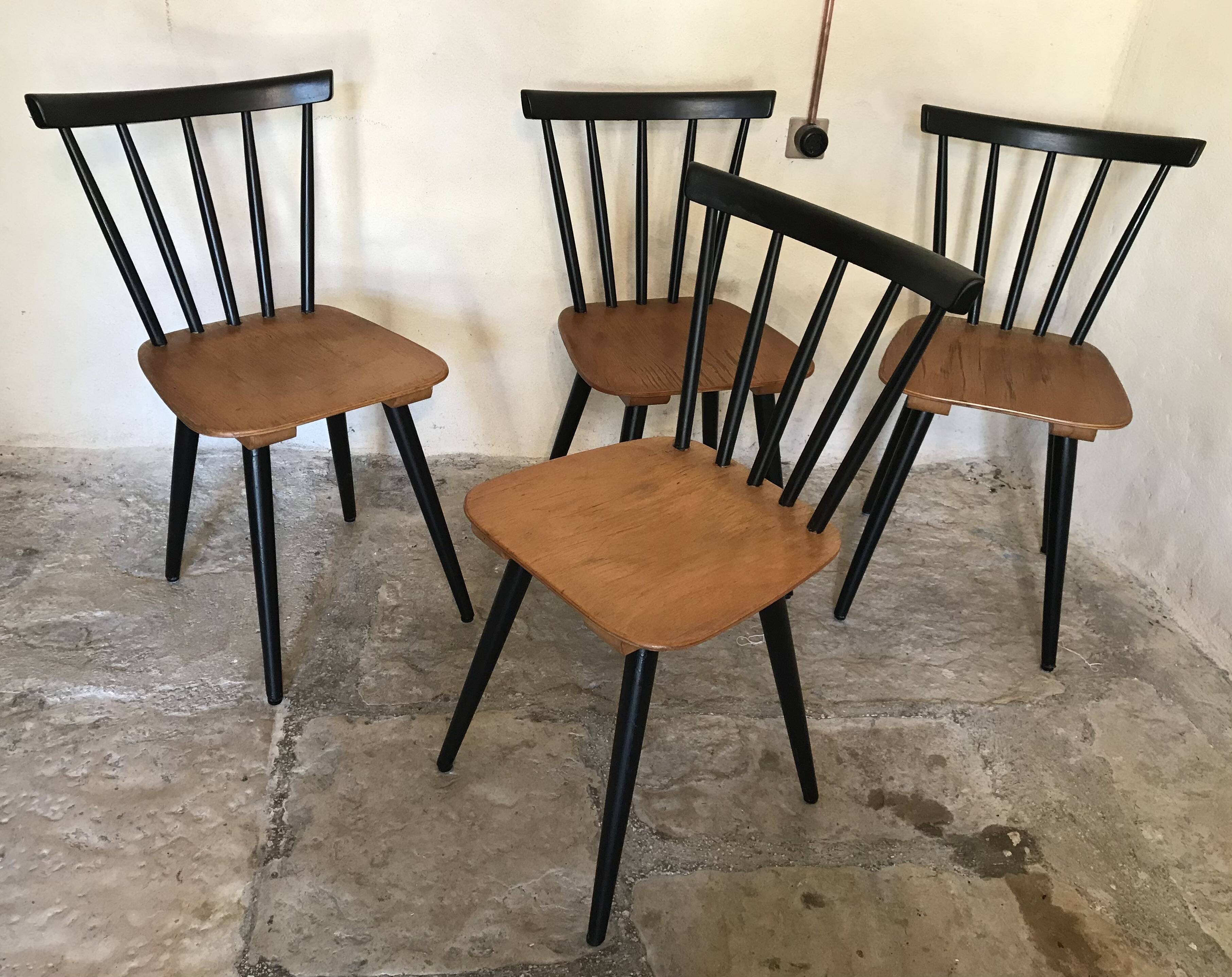 Set of 4 vintage 1960's chairs with bars and black compass legs
