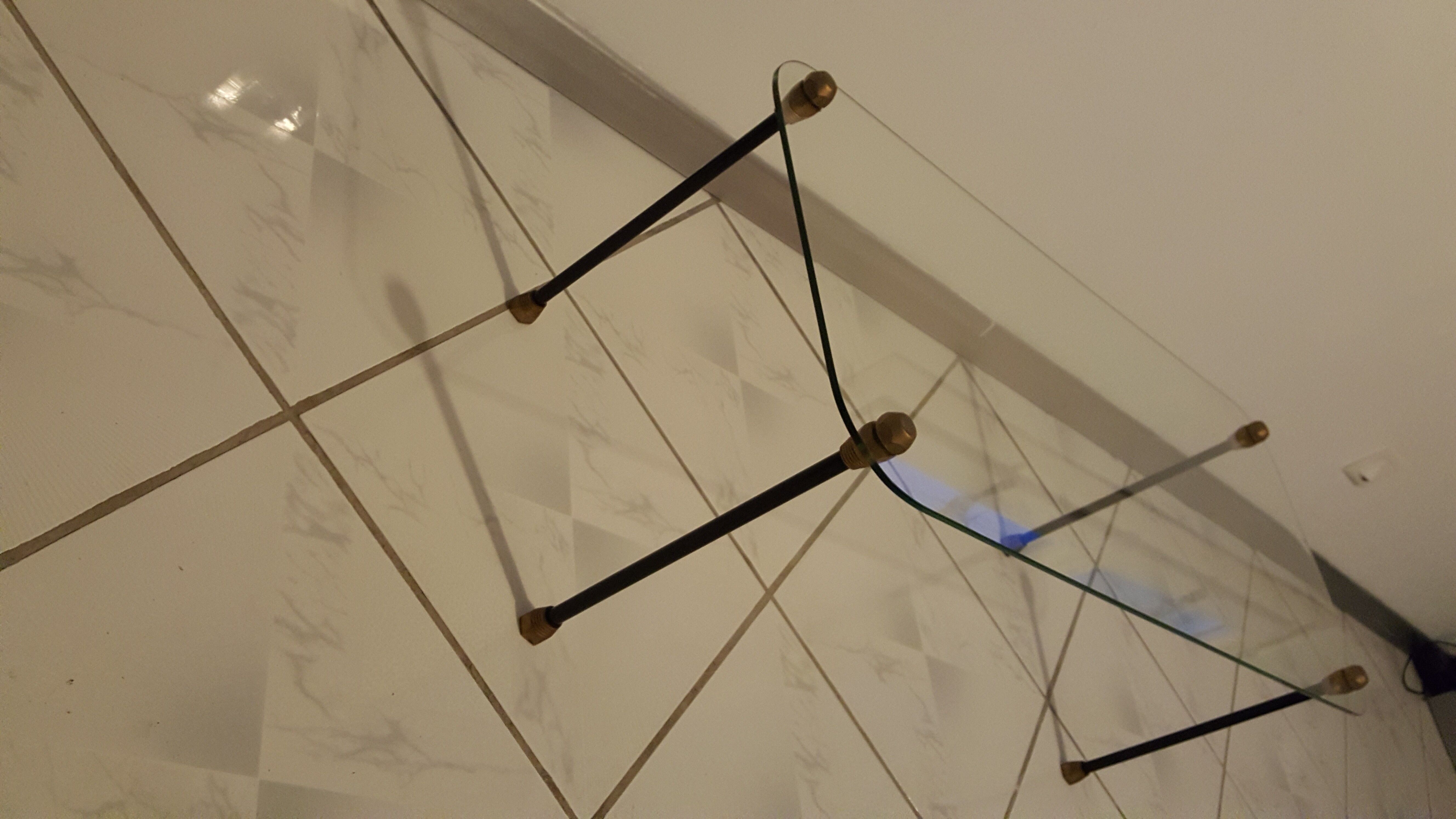 Glass table with brass tip