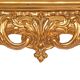 Console with a gilded wooden mirror.