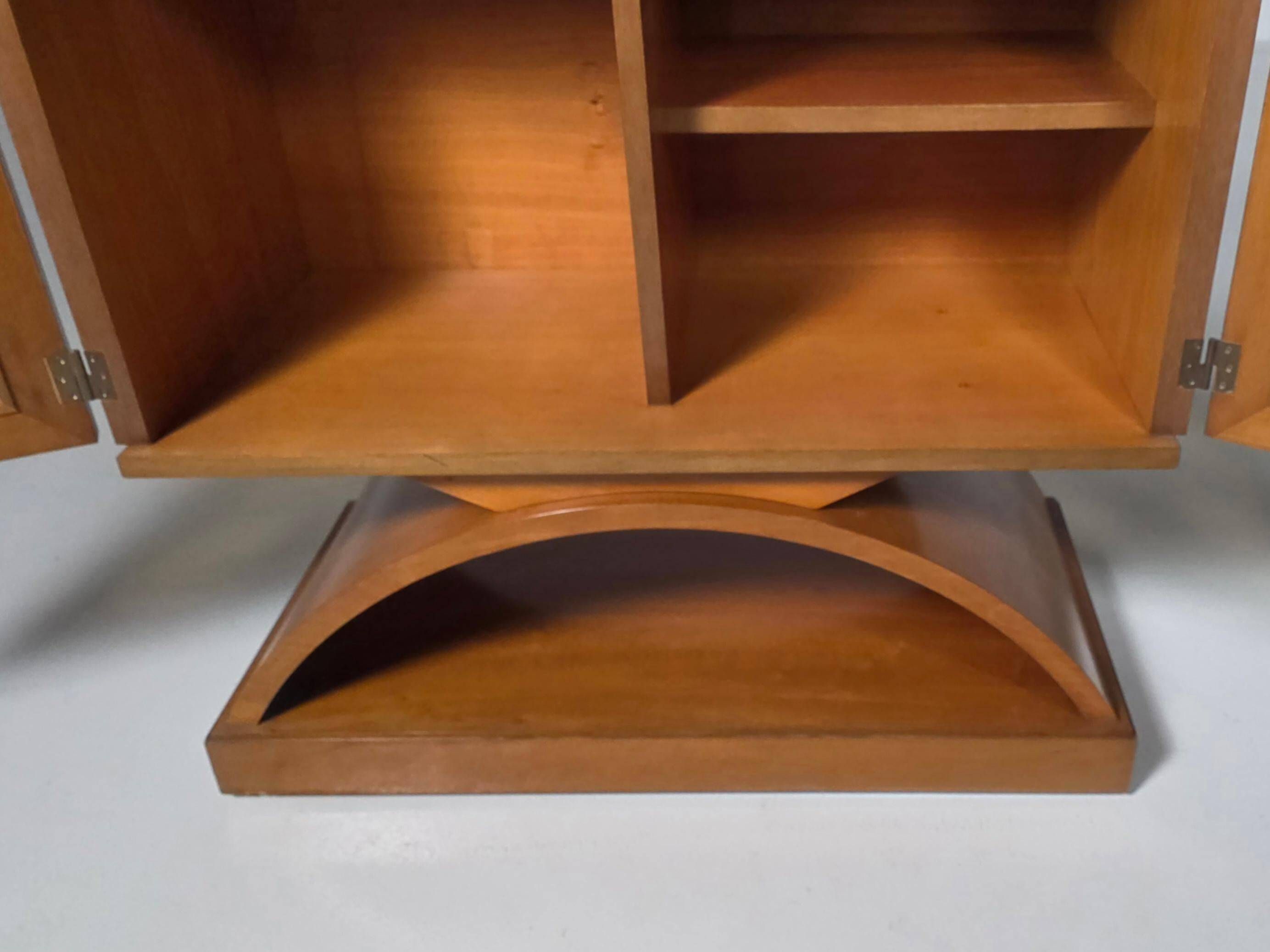 Mid-century modern mobile bar cabinet with sculptural base, 1950s.